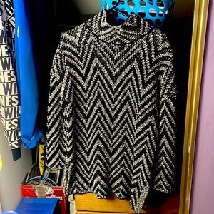 This Joan Vass  sweater is in wicked condition is a size M.